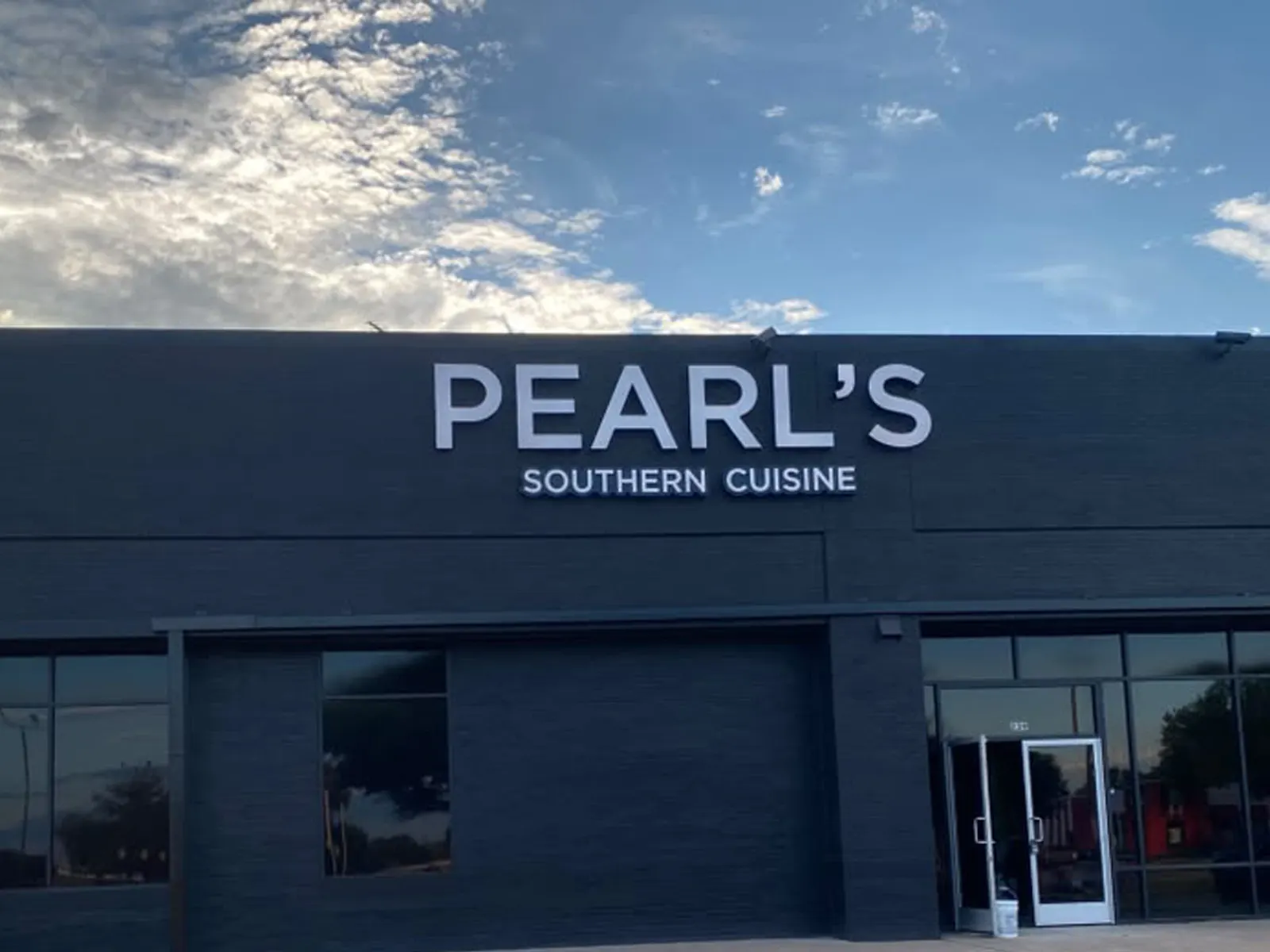 Pearl's Southern Cuisine white letters on a dark painted restaurant facade