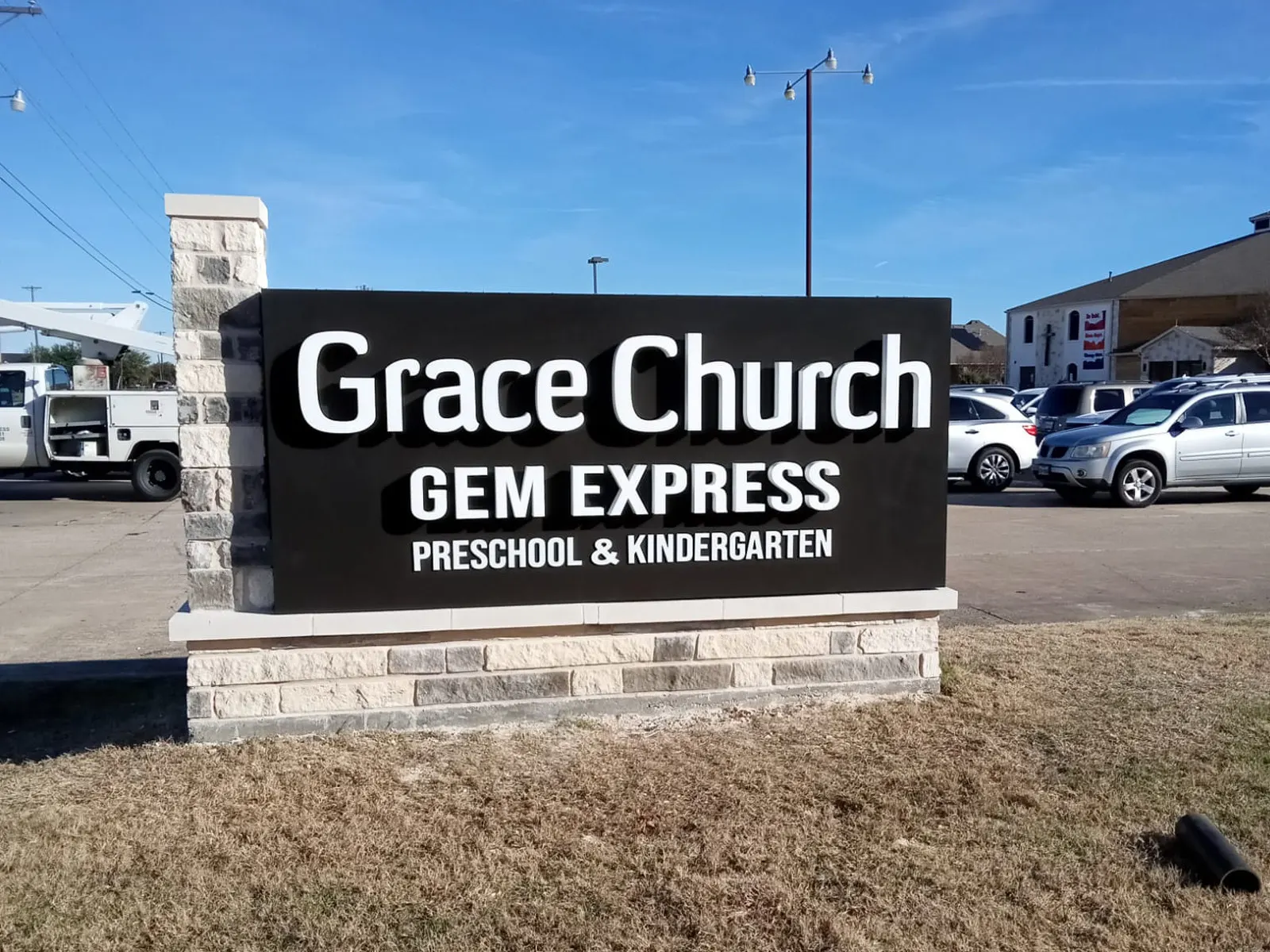 Grace Church and Gem Express Preschool monument sign on a limestone base