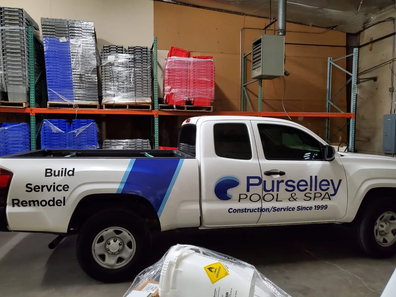 Purselley Pool and Spa pickup truck with blue and white graphics
